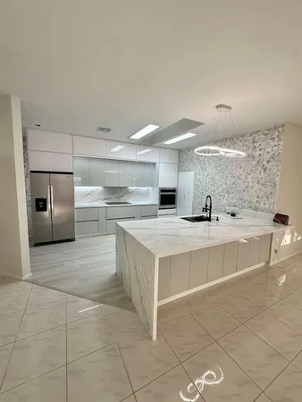 a kitchen with a stove and a refrigerator