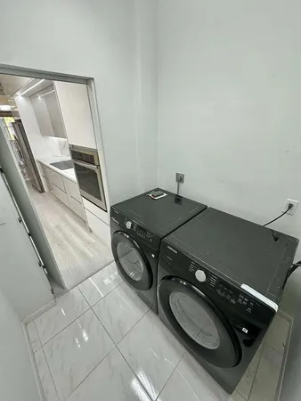 a kitchen with stainless steel appliances a sink and cabinets