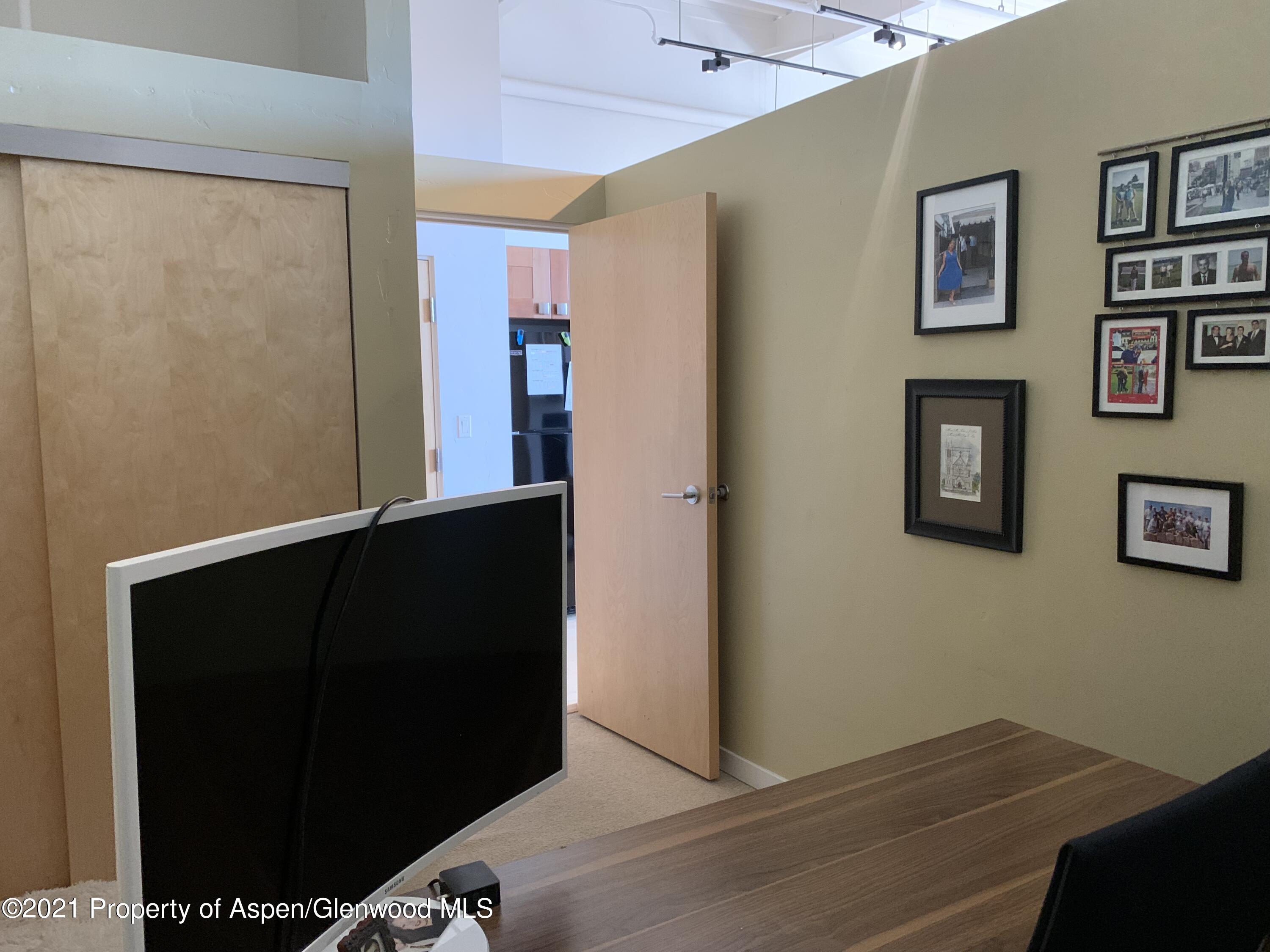 231 Robinson Street, Unit R302 Basalt, CO 81621 - Photo 12 of 31 a view of a hallway with workspace