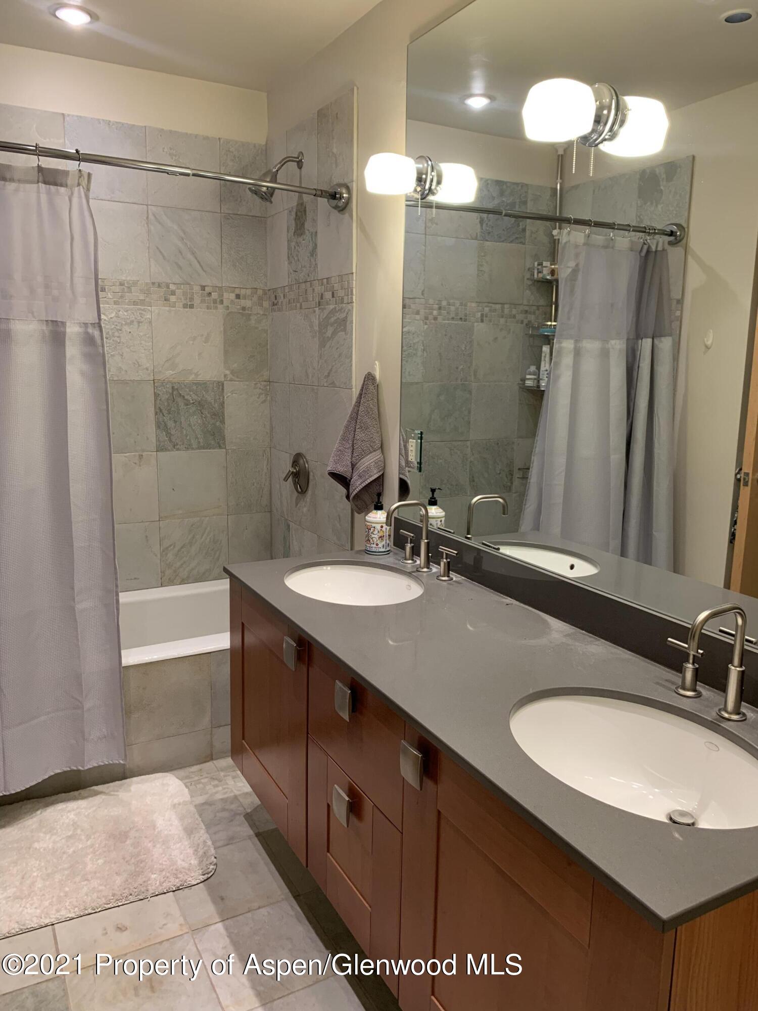 231 Robinson Street, Unit R302 Basalt, CO 81621 - Photo 20 of 31 a bathroom with a sink double vanity and a mirror