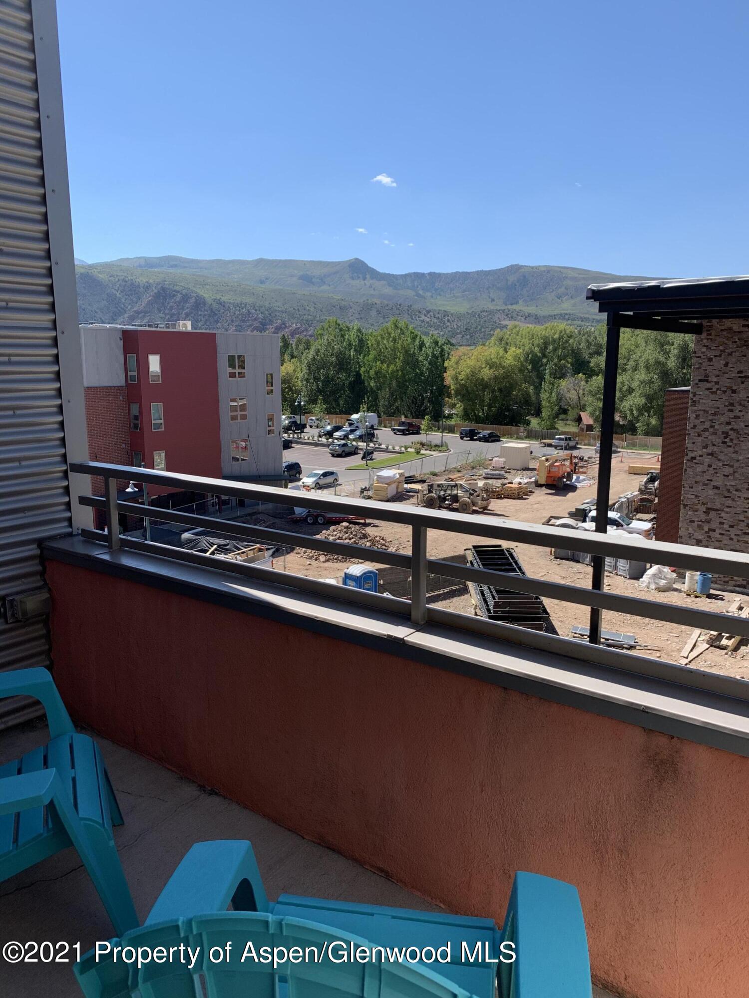 231 Robinson Street, Unit R302 Basalt, CO 81621 - Photo 28 of 31 a view of a yard with an outdoor seating