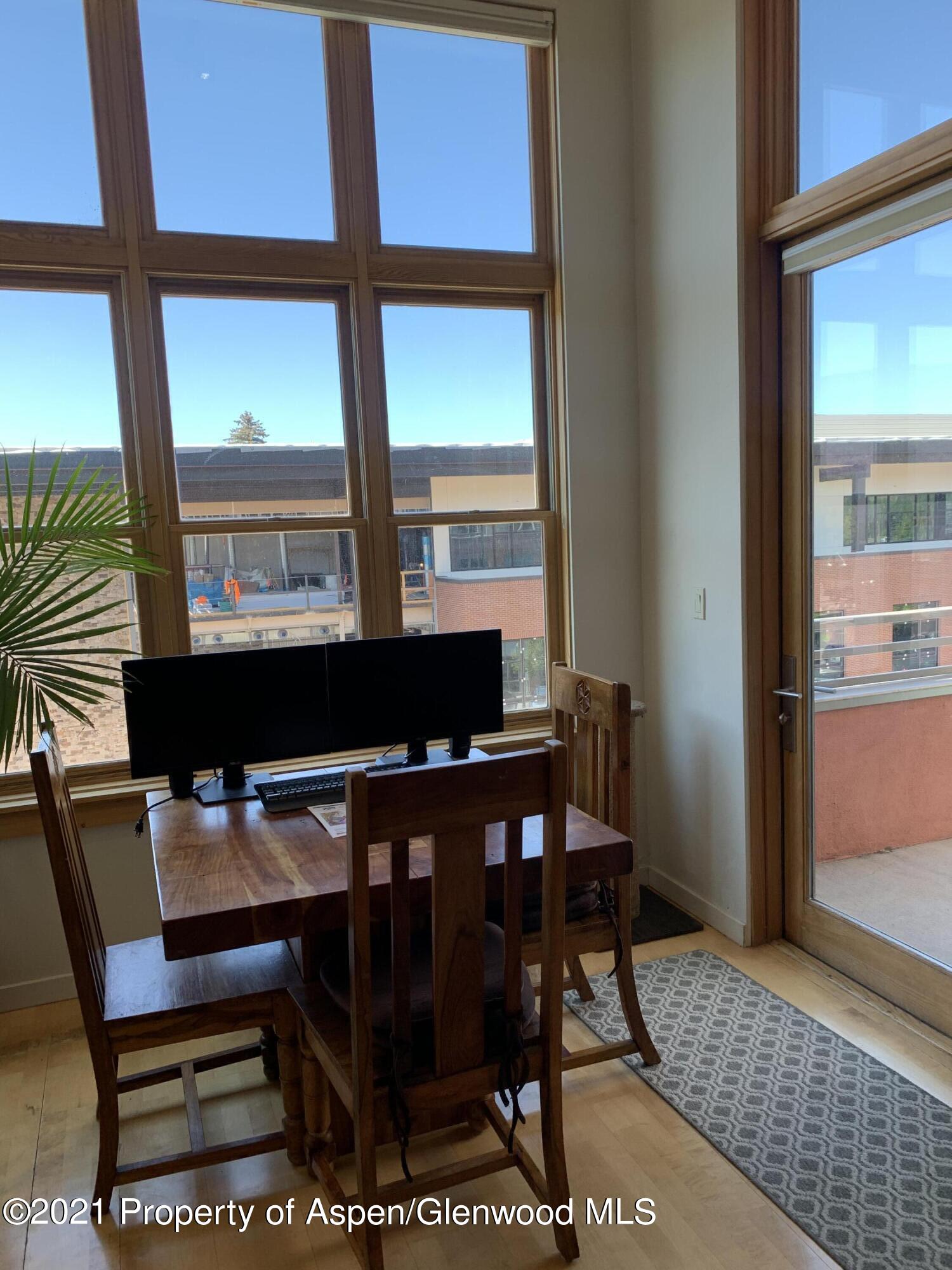 231 Robinson Street, Unit R302 Basalt, CO 81621 - Photo 6 of 31 a view of a dining room with furniture and window