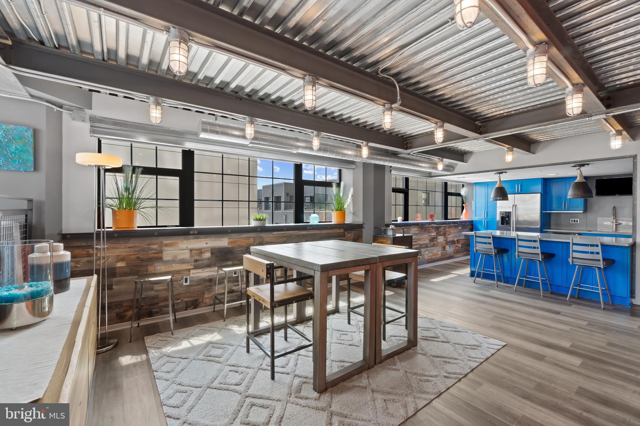 1200 Steuart Street, Unit 1119 Baltimore, MD 21230 - Photo 14 of 37 a view of a dining room with furniture