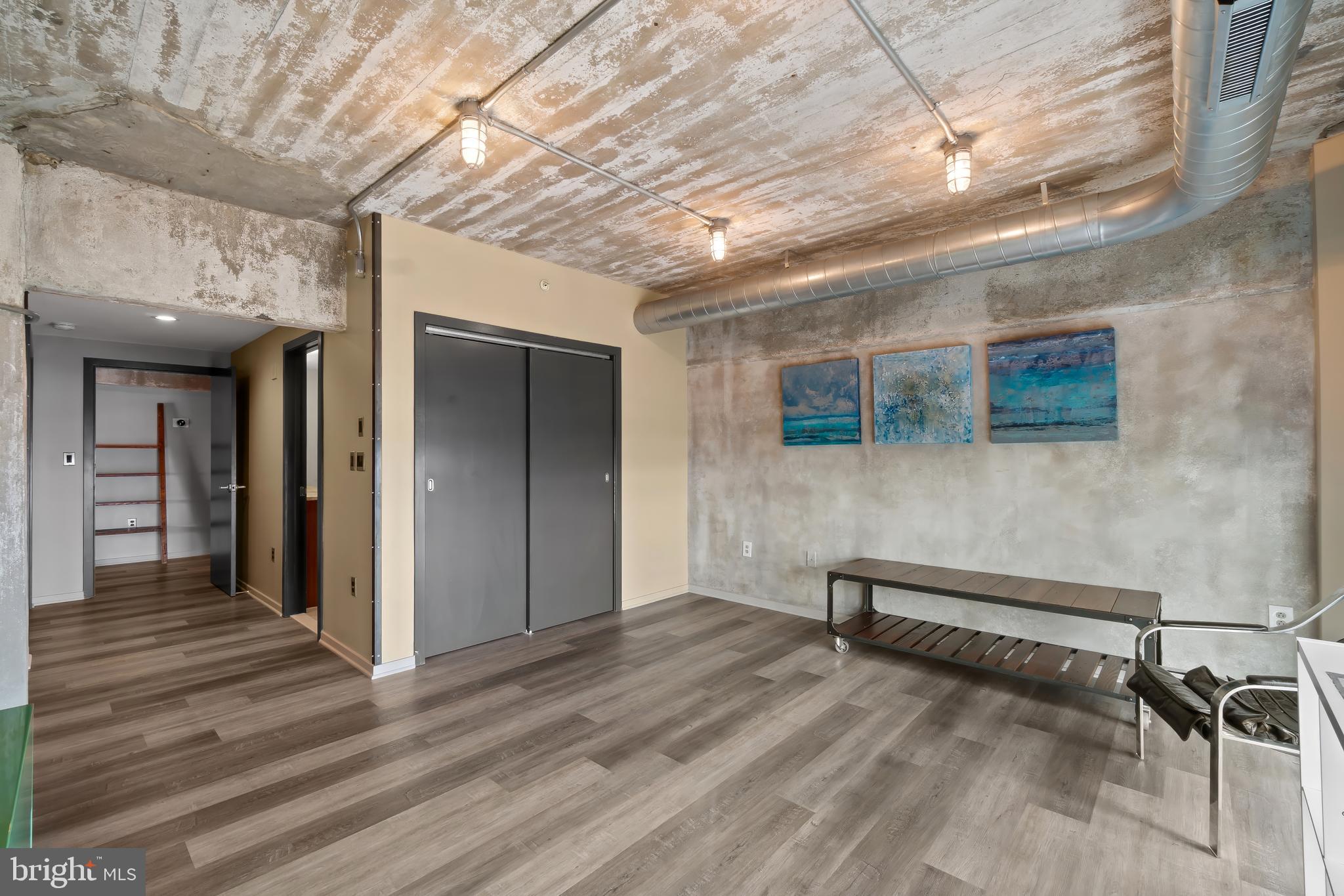 1200 Steuart Street, Unit 1119 Baltimore, MD 21230 - Photo 21 of 37 a view of empty room with wooden floor