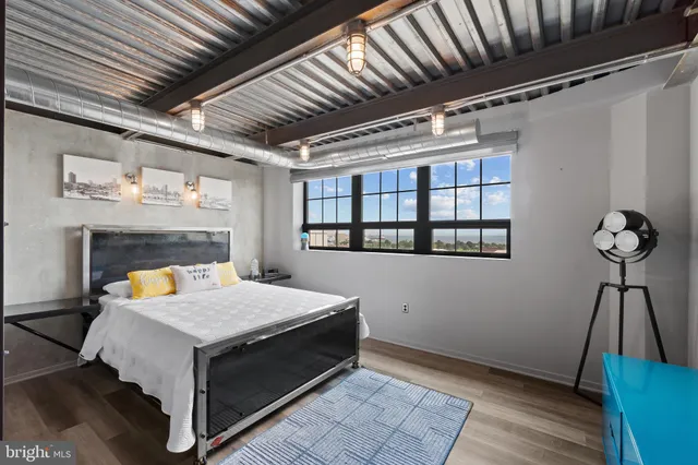 a kitchen with stainless steel appliances a refrigerator and a wooden cabinets