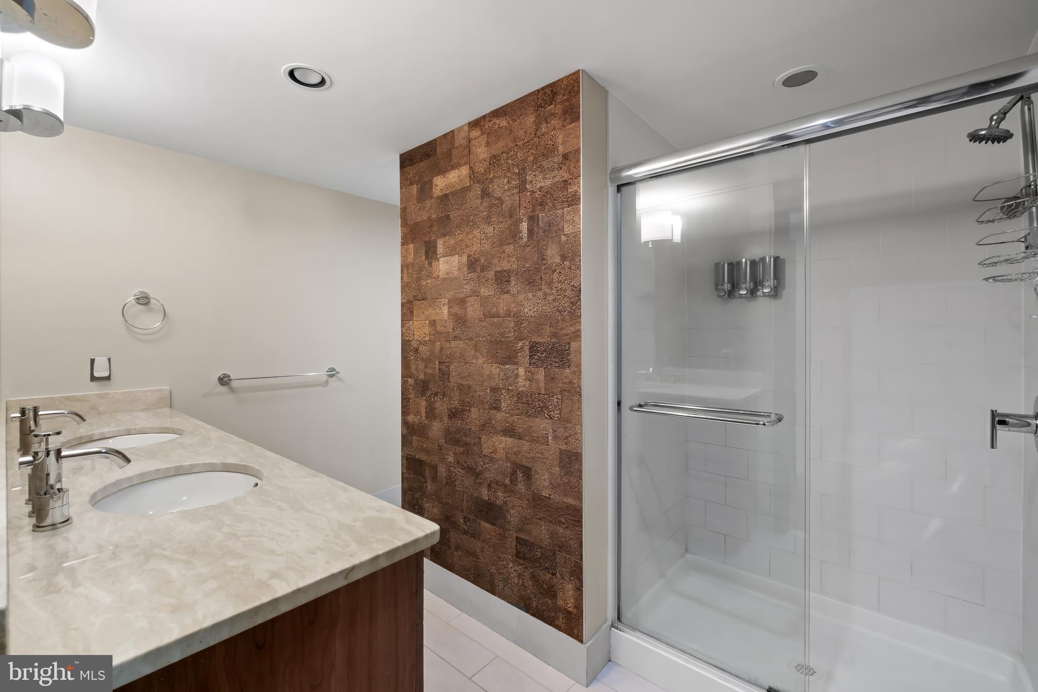 1200 Steuart Street, Unit 1119 Baltimore, MD 21230 - Photo 30 of 37 a bathroom with a sink and a mirror