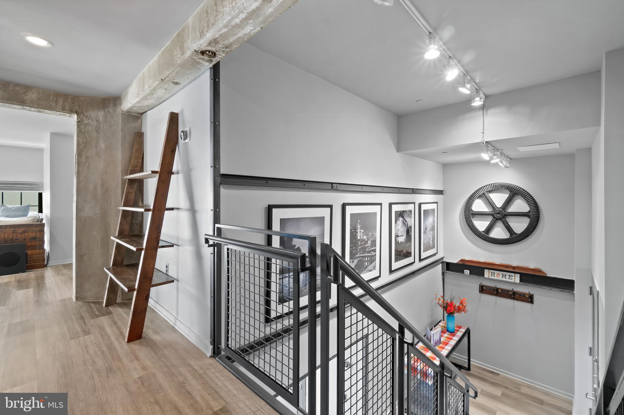1200 Steuart Street, Unit 1119 Baltimore, MD 21230 - Photo 8 of 37 a view of a hallway with wooden floor and entryway