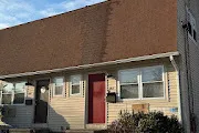 front view of a house with a small yard