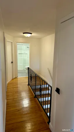 a view of entryway with wooden floor