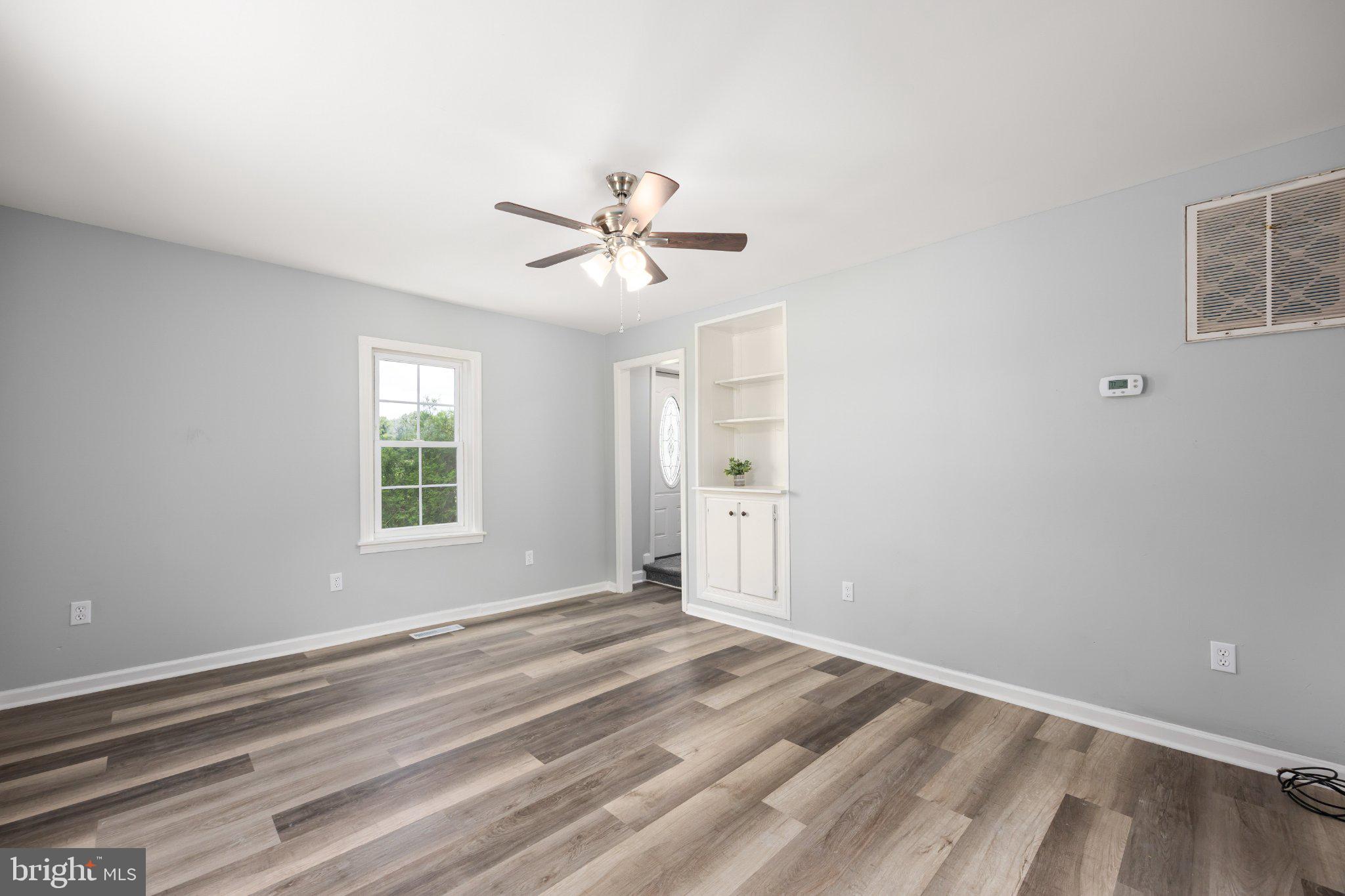 465 Hall Road Pocomoke City, MD 21851 - Photo 22 of 43 Living room with built in book shelf