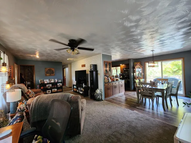 a view of a dining room with furniture window and outside view