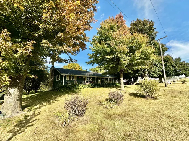 a view of a garden with a building in the background