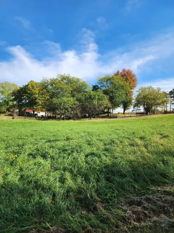 a view of a house with a big yard
