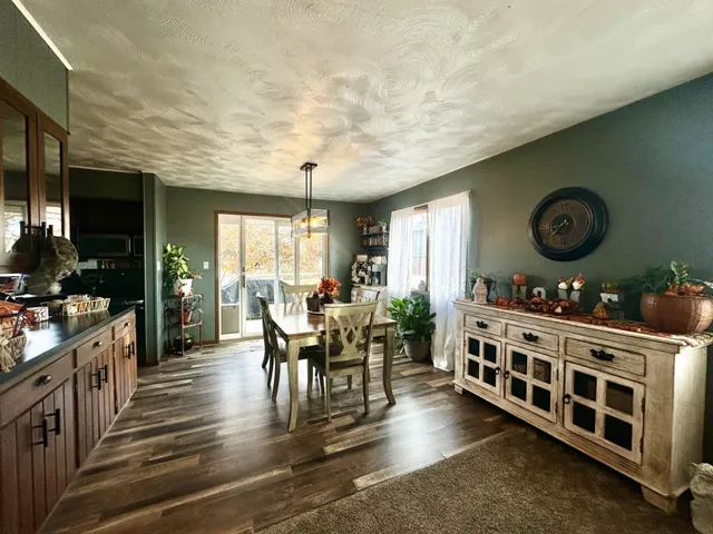 a large white kitchen with a large window