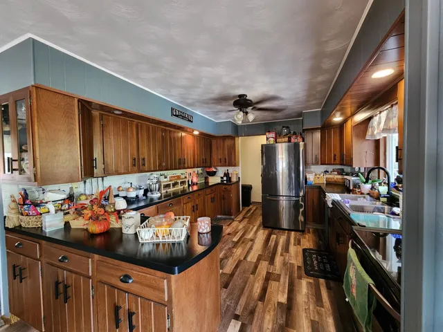 a kitchen with lots of counter space and stainless steel appliances
