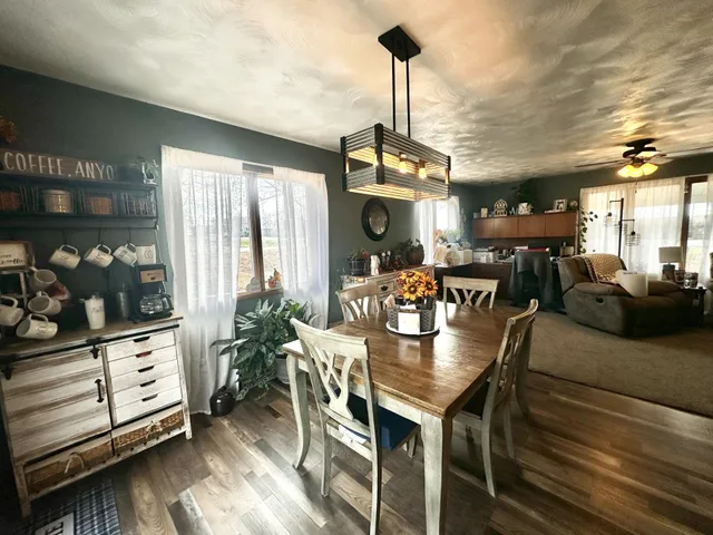 a view of a dining room with furniture window and outside view