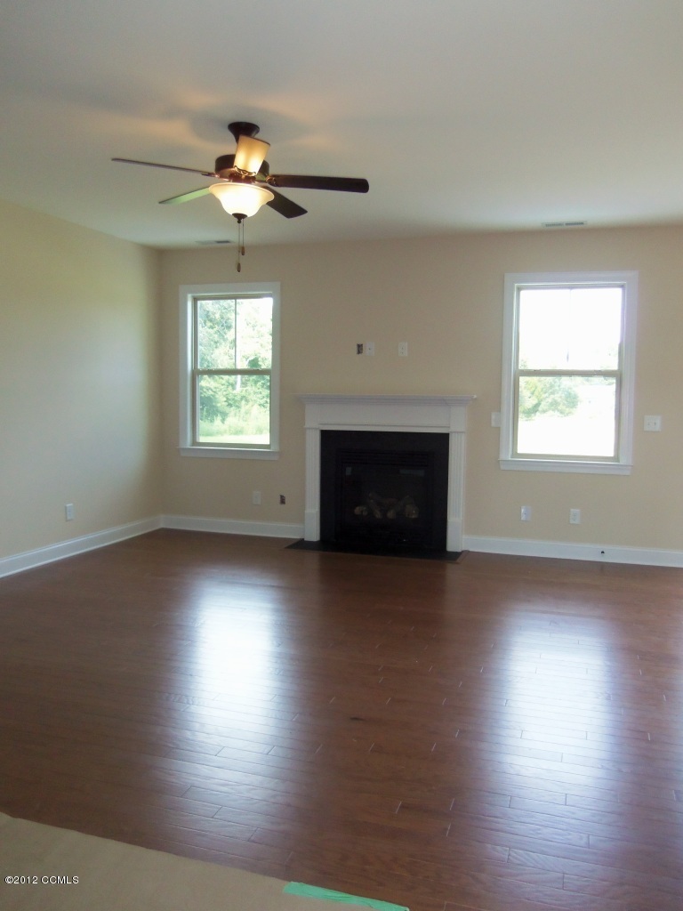 102 Summer Rst Trail Hubert, NC 28539 - Photo 8 of 9 Family Room features engineered hardwood floors and gas fireplace.