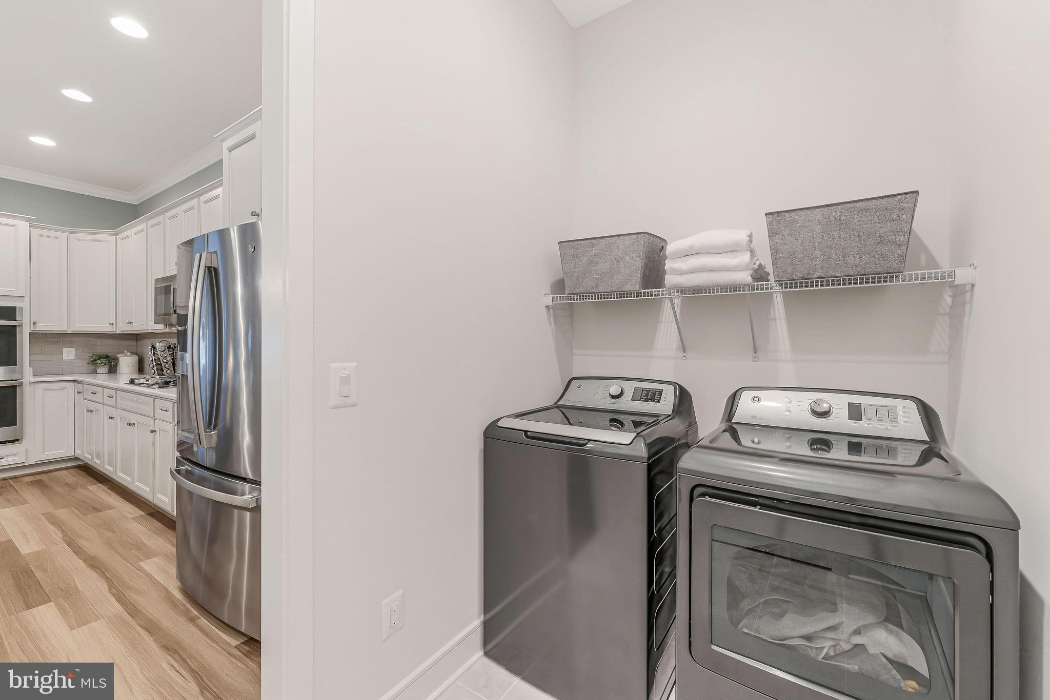 23707 Kinston Ferry Terrace Ashburn, VA 20148 - Photo 19 of 42 a kitchen with a stove and a refrigerator