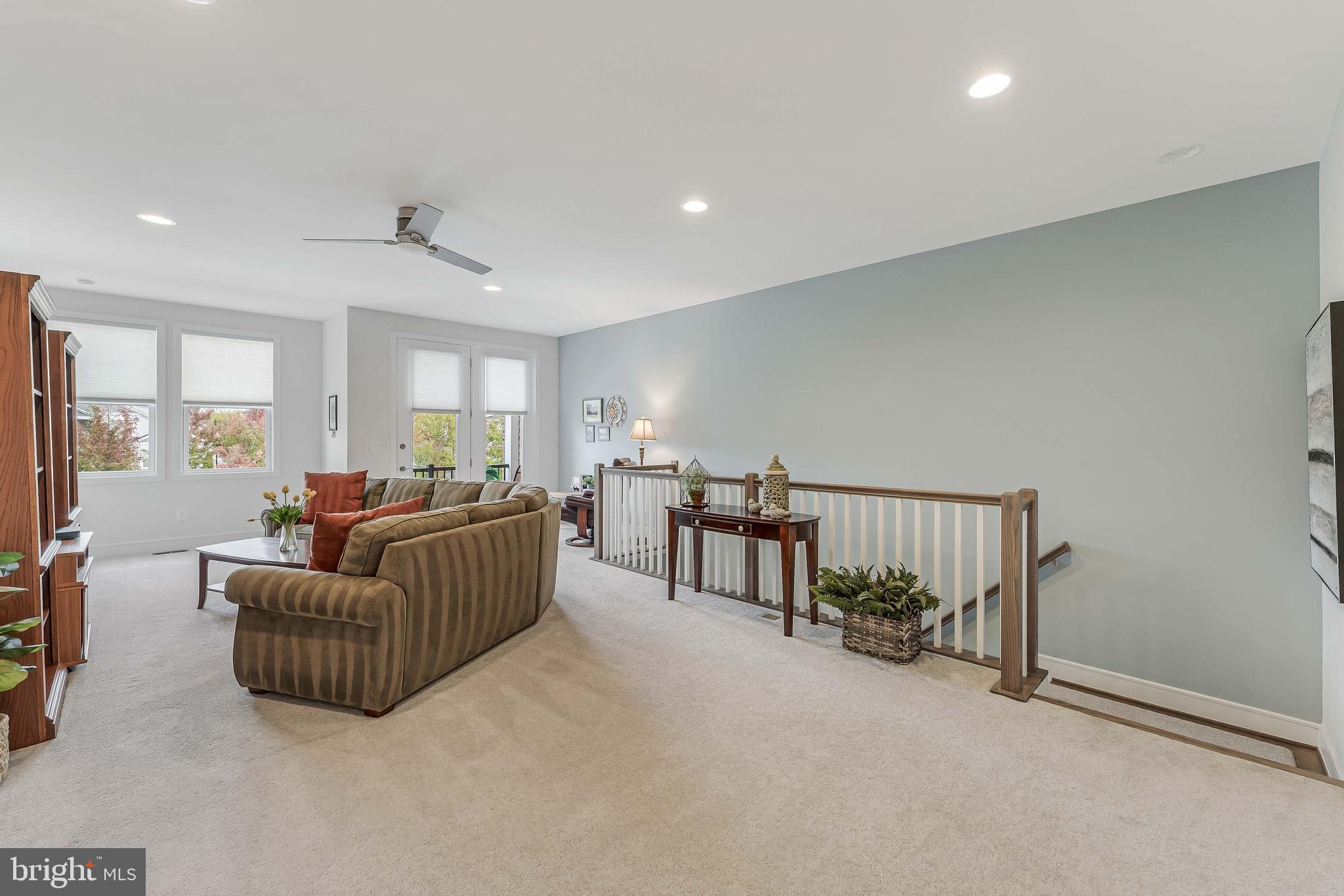 23707 Kinston Ferry Terrace Ashburn, VA 20148 - Photo 21 of 42 a living room with furniture and a window