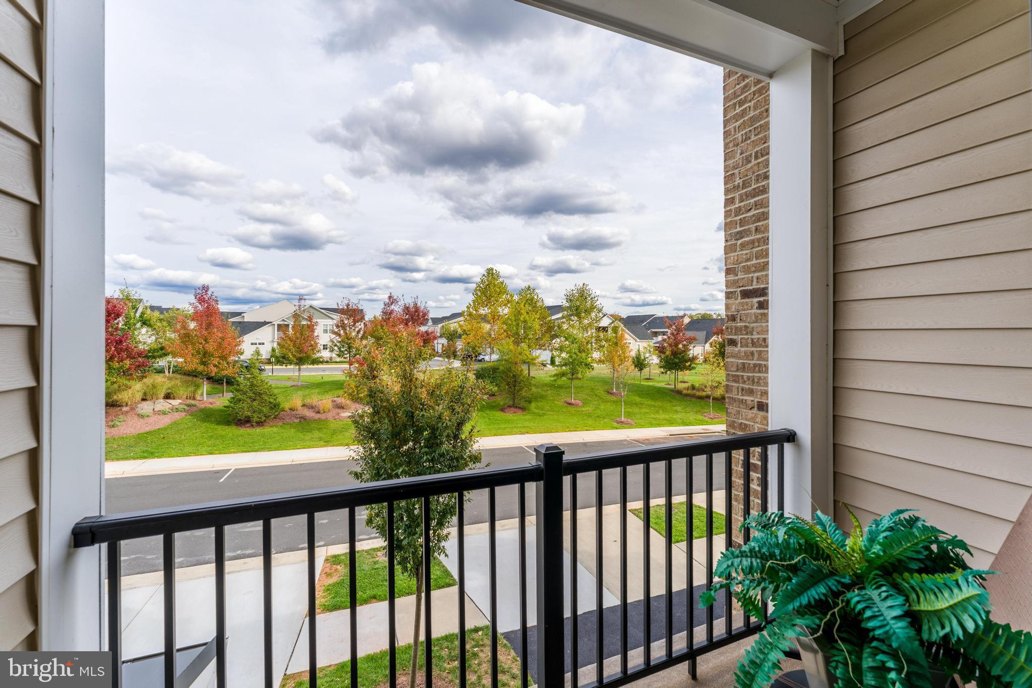 23707 Kinston Ferry Terrace Ashburn, VA 20148 - Photo 26 of 42 a view of a balcony next to a yard