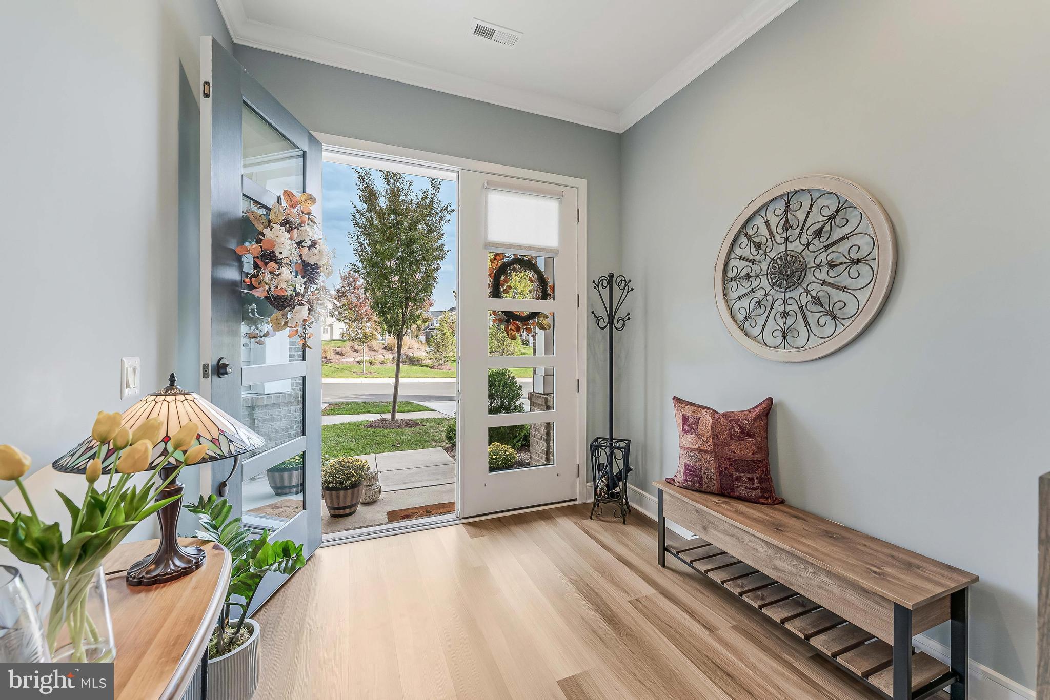 23707 Kinston Ferry Terrace Ashburn, VA 20148 - Photo 3 of 42 a bedroom with furniture and a window