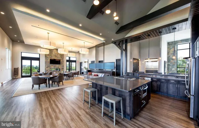 a large kitchen with stainless steel appliances lots of counter space