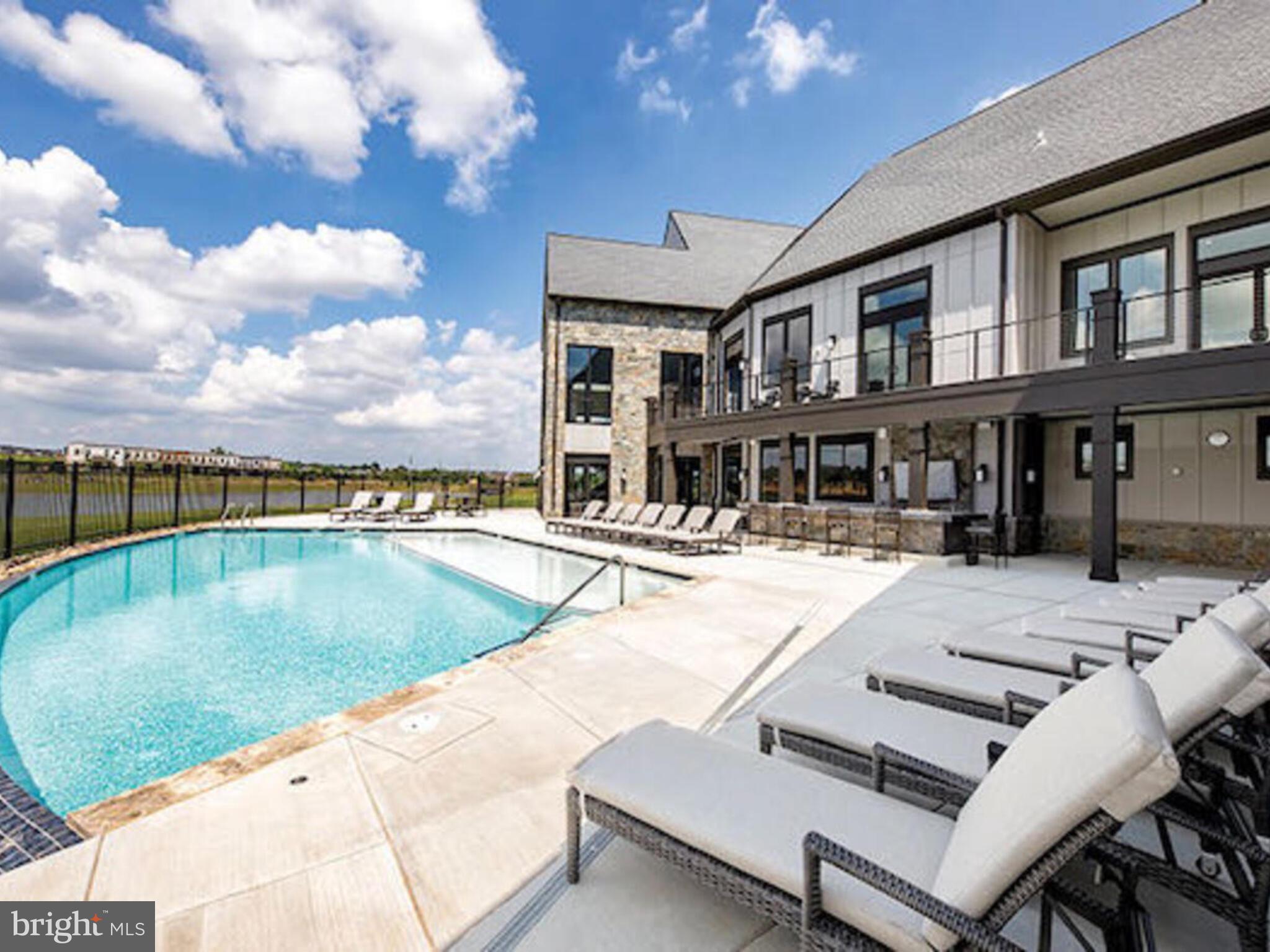 23707 Kinston Ferry Terrace Ashburn, VA 20148 - Photo 37 of 42 a swimming pool with outdoor seating and yard