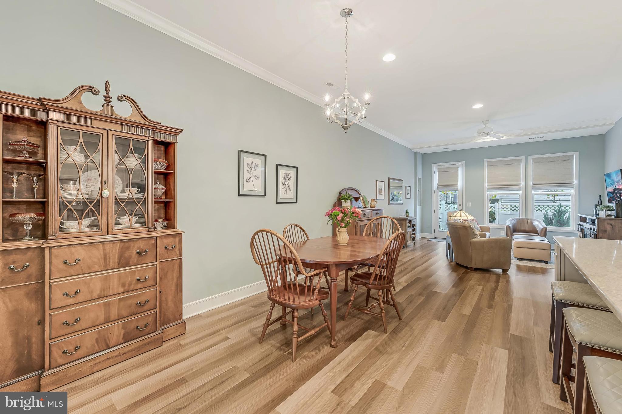 23707 Kinston Ferry Terrace Ashburn, VA 20148 - Photo 9 of 42 a view of a dining room with furniture and wooden floor