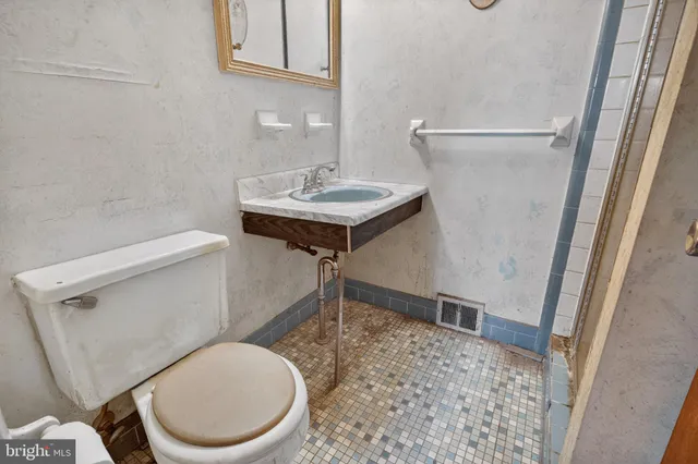 a bathroom with a toilet and a sink