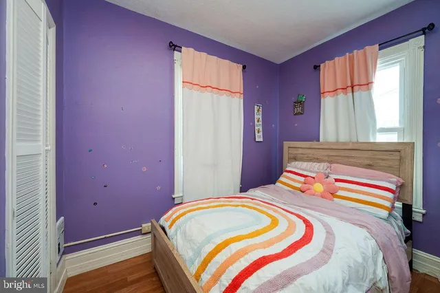 a bathroom with a toilet a sink and a mirror