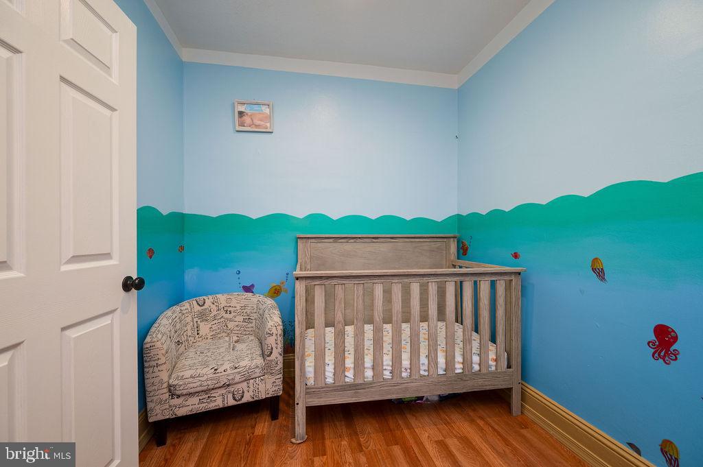 431 South 11th Street Reading, PA 19602 - Photo 29 of 43 Whimsical nursery with ocean-themed decor.