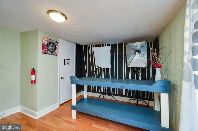 a bedroom with a bed and a night stand