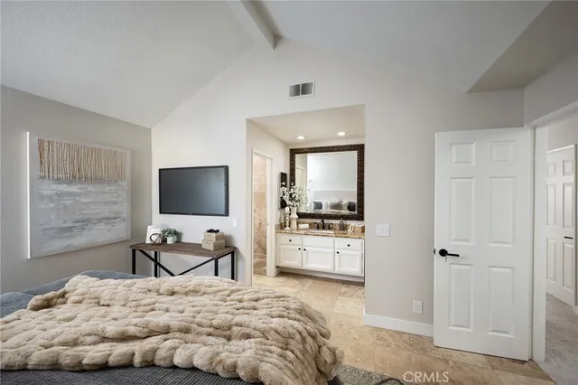a bed room with a bed and a tv