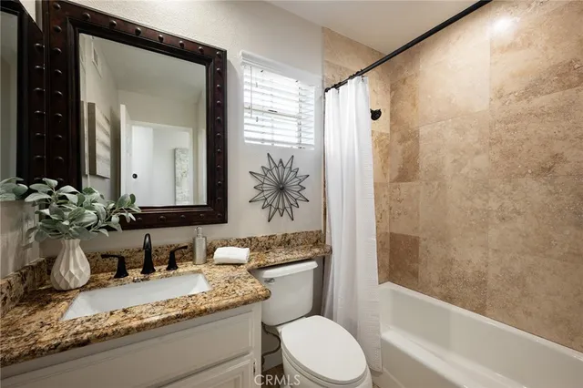 a bedroom with bed and a window