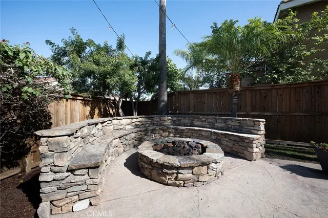 a view of a house with a yard and furniture