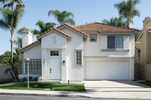 a front view of a house with a garage
