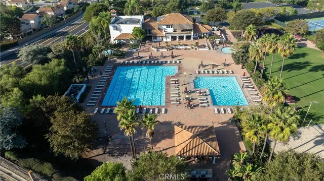an aerial view of residential houses with outdoor space and street view