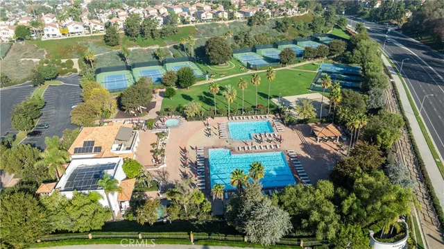 an aerial view of lake and residential houses with outdoor space