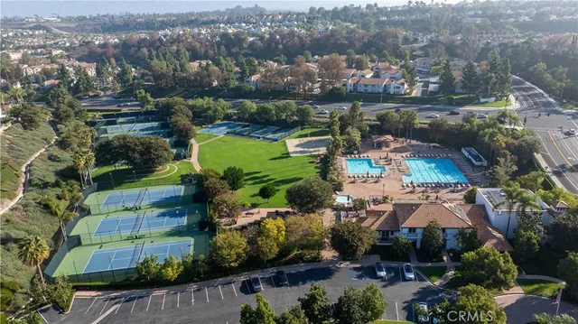 an aerial view of a house with yard