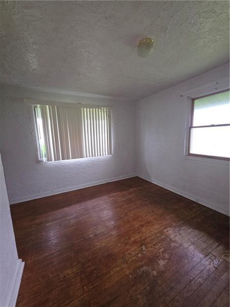 1356 Connellsville Road Lemont Furnace, PA 15456 - Photo 11 of 15 an empty room with a window
