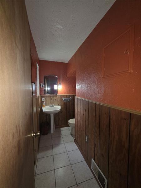 1356 Connellsville Road Lemont Furnace, PA 15456 - Photo 12 of 15 a bathroom with a sink and a mirror