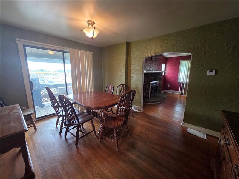 1356 Connellsville Road Lemont Furnace, PA 15456 - Photo 8 of 15 a view of a dining room with furniture and wooden floor