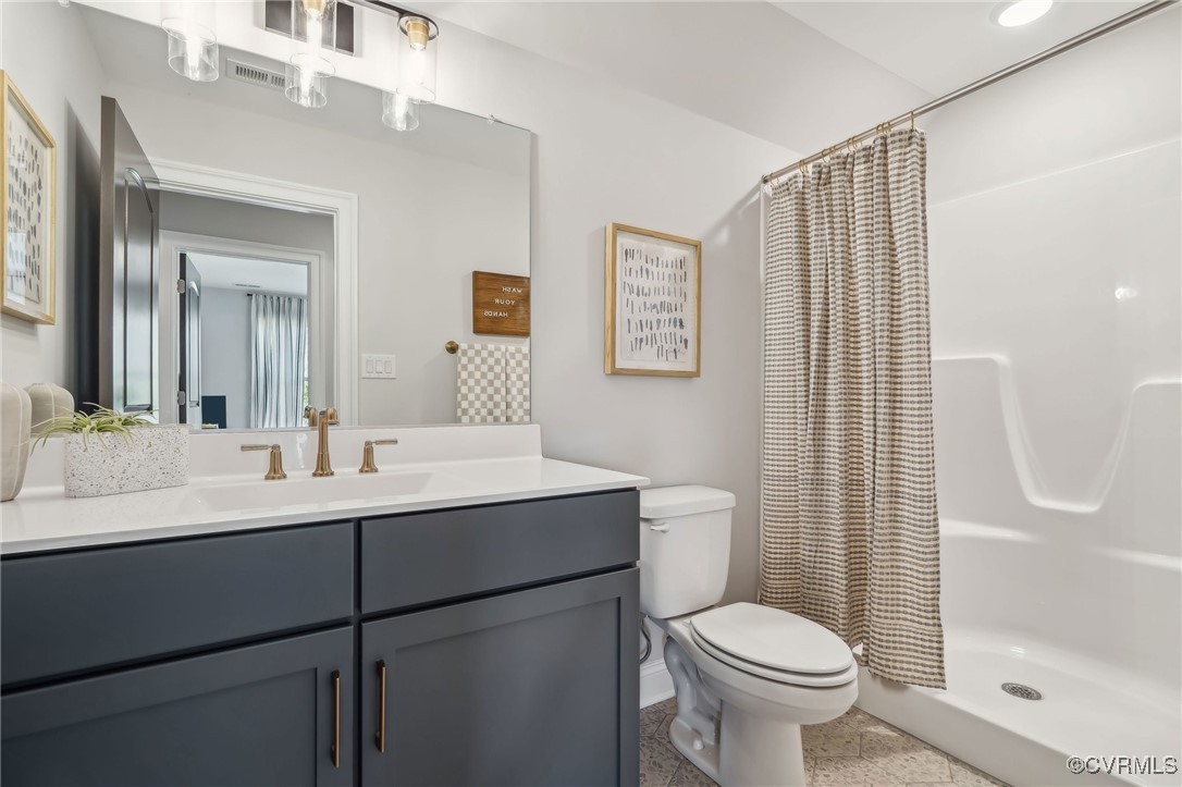 16873 Watchman Way Beaverdam, VA 23015 - Photo 26 of 40 a bathroom with a sink toilet and shower