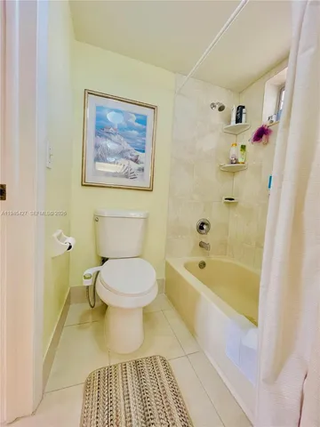 a bathroom with a bathtub and a toilet