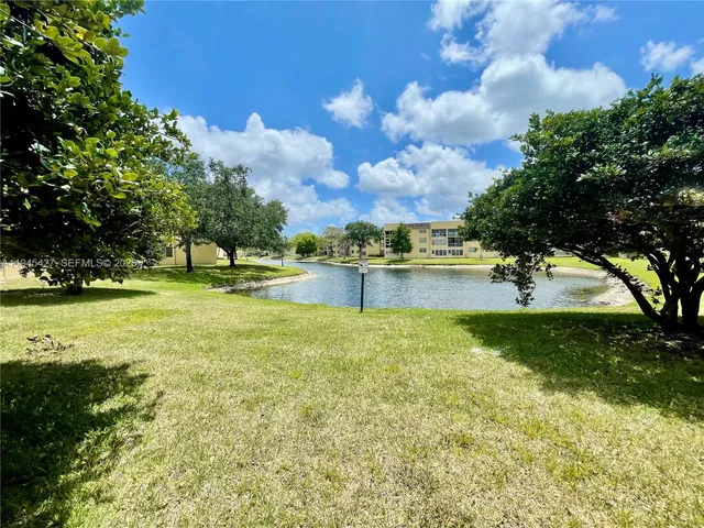 a view of a lake with houses in the background
