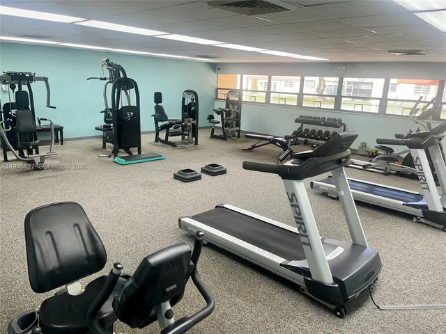 a room with gym equipment and a window