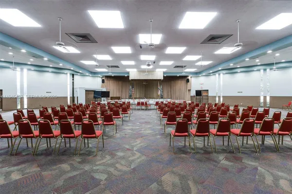 a dining room with lots of tables and chairs