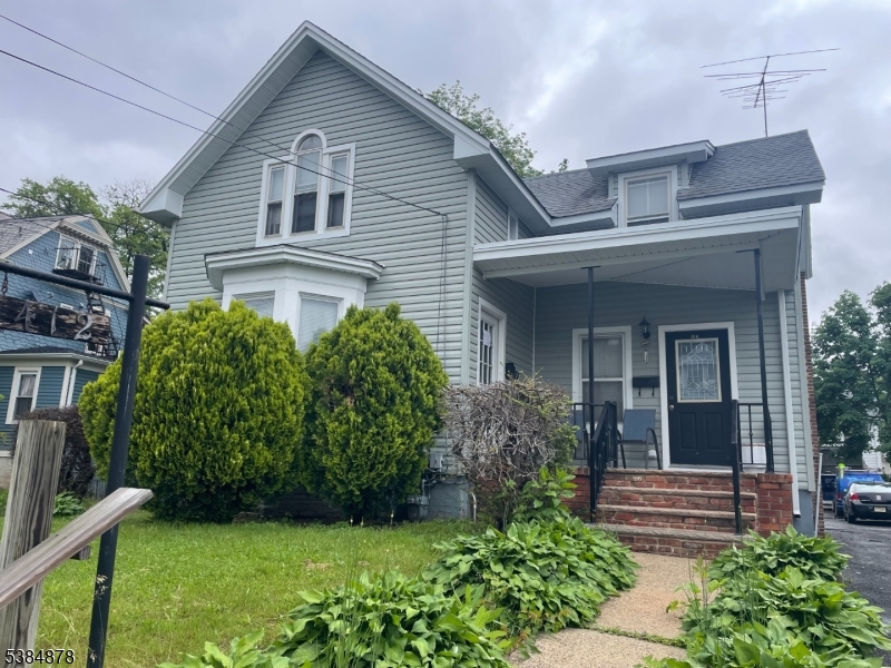 412 South Valley Road Orange, NJ 07050 - Photo 13 of 18 a front view of a house with garden