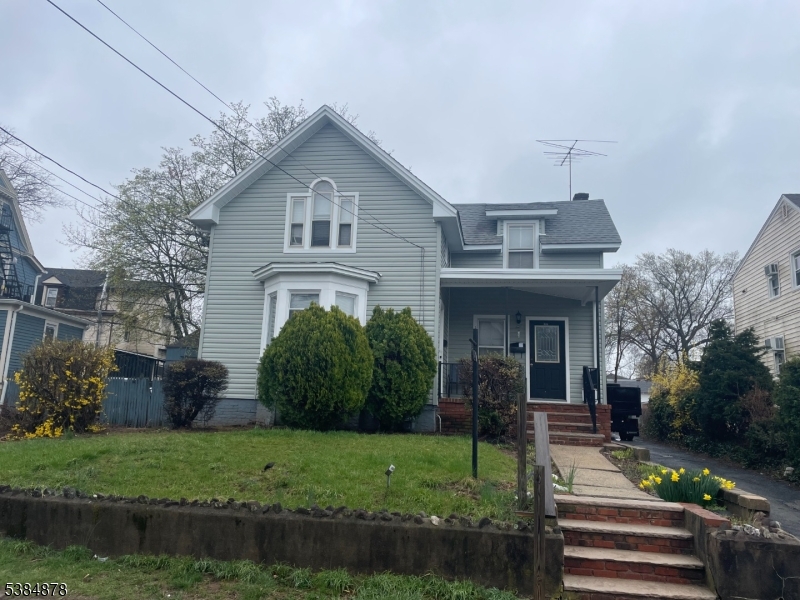 412 South Valley Road Orange, NJ 07050 - Photo 3 of 18 a front view of a house with a yard
