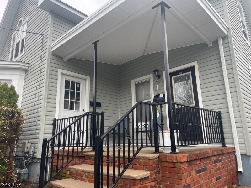 412 South Valley Road Orange, NJ 07050 - Photo 4 of 18 a view of staircase with wooden floor and white walls